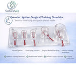 Clear acrylic tray with five transparent vessel models and red sutures for vascular ligation training simulator practice